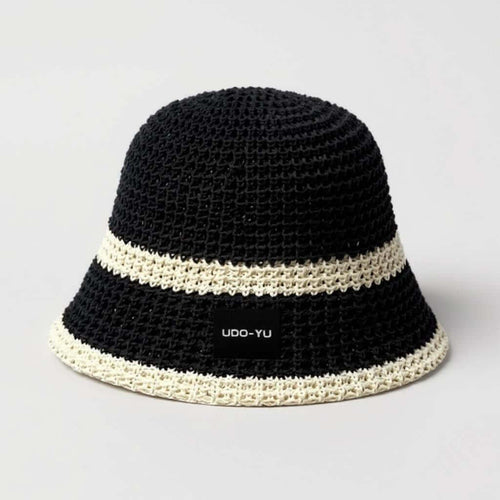 Handmade crochet bucket hat in black with white stripes, adjustable brim for comfort and style, perfect for sunny days.
